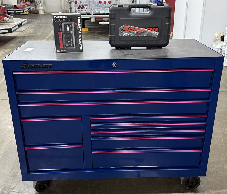 Snap-On roll cab tool box, Snap-On general service set, and NOCO jump starter -- the three raffle prizes